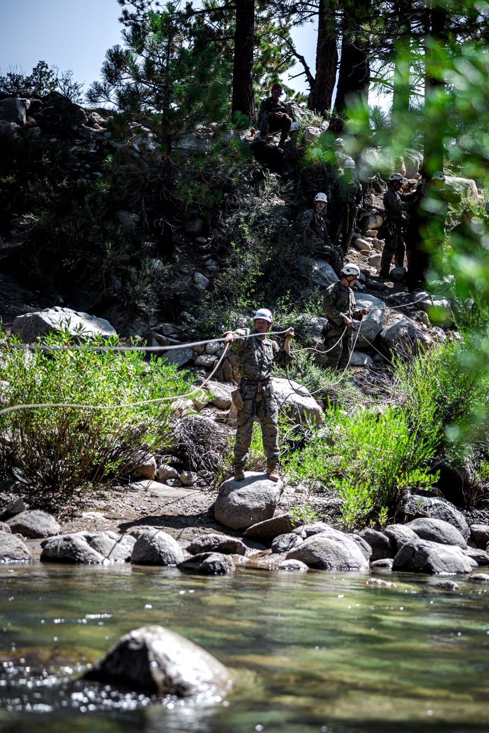 Marines with 2nd Battalion, 1st Marine Regiment practice setting up one rope bridges