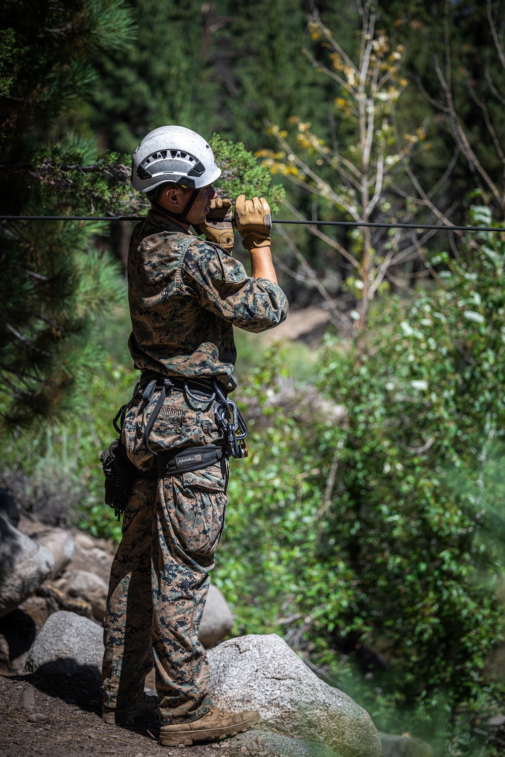 Marines with 2nd Battalion, 1st Marine Regiment practice setting up one rope bridges