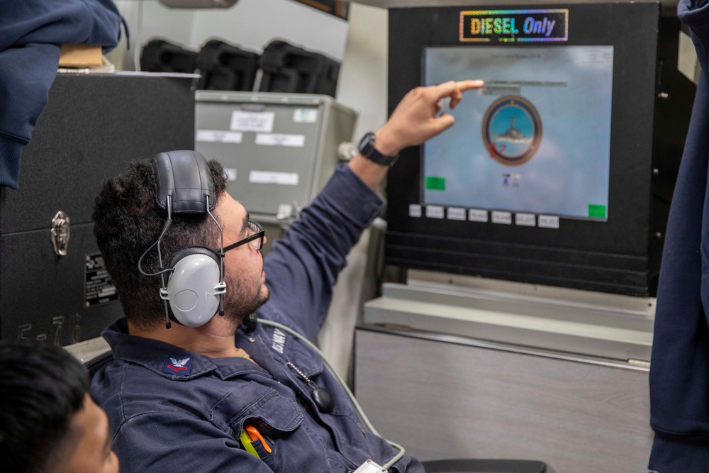 USS Spruance Sailor monitors fuel intake