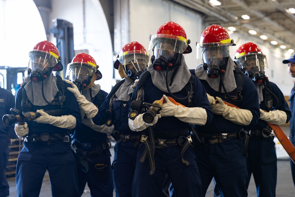 Sailors Conduct Firefighting Drill in the Hangar Bay