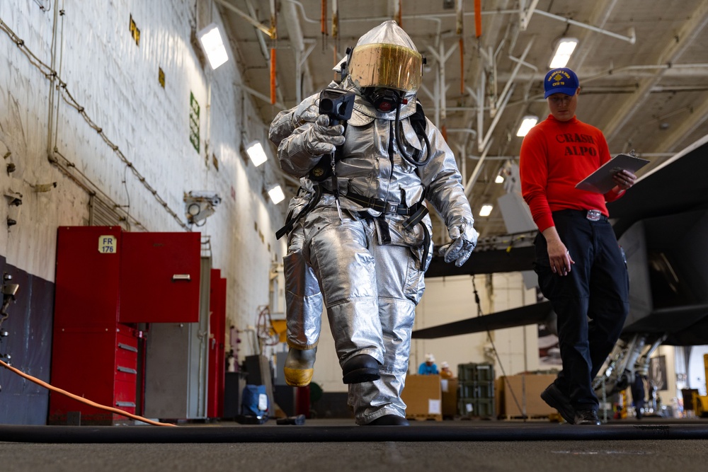 Sailors Conduct Firefighting Drill in the Hangar Bay