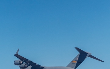 Two C-17s Fly Formation Over Edwards AFB