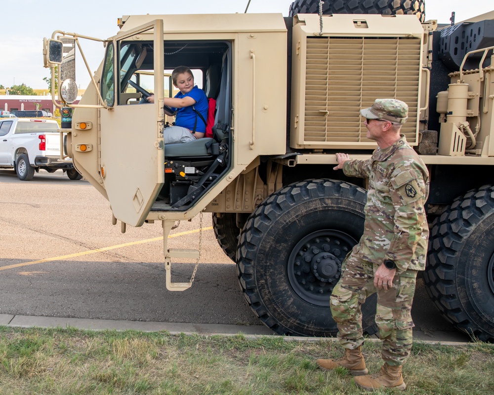 Families explore vehicles at National Night Out