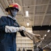 USS George Washington (CVN 73) Sailors practice pipe patching during damage control training