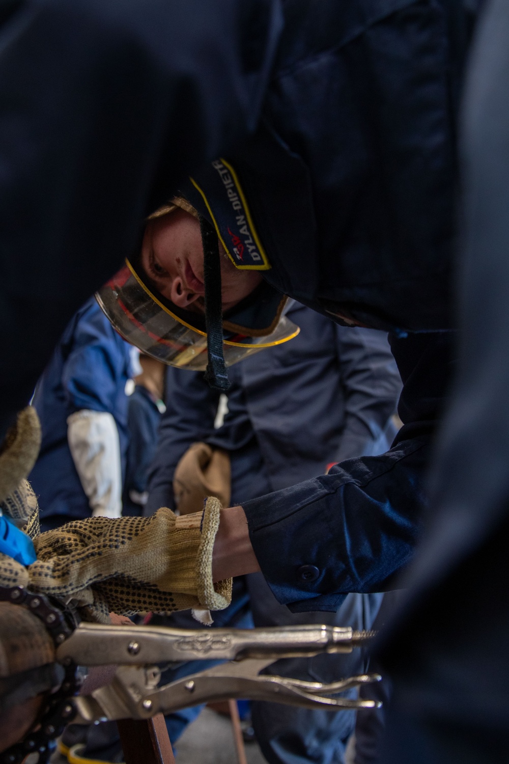 USS George Washington (CVN 73) Sailors practice pipe patching during damage control training