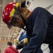 USS George Washington (CVN 73) Sailors practice pipe patching during damage control training