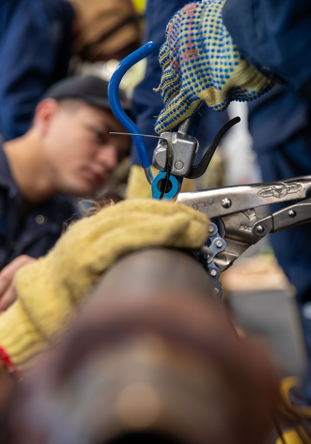 USS George Washington (CVN 73) Sailors practice pipe patching during damage control training