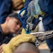 USS George Washington (CVN 73) Sailors practice pipe patching during damage control training