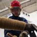 USS George Washington (CVN 73) Sailors practice pipe patching during damage control training