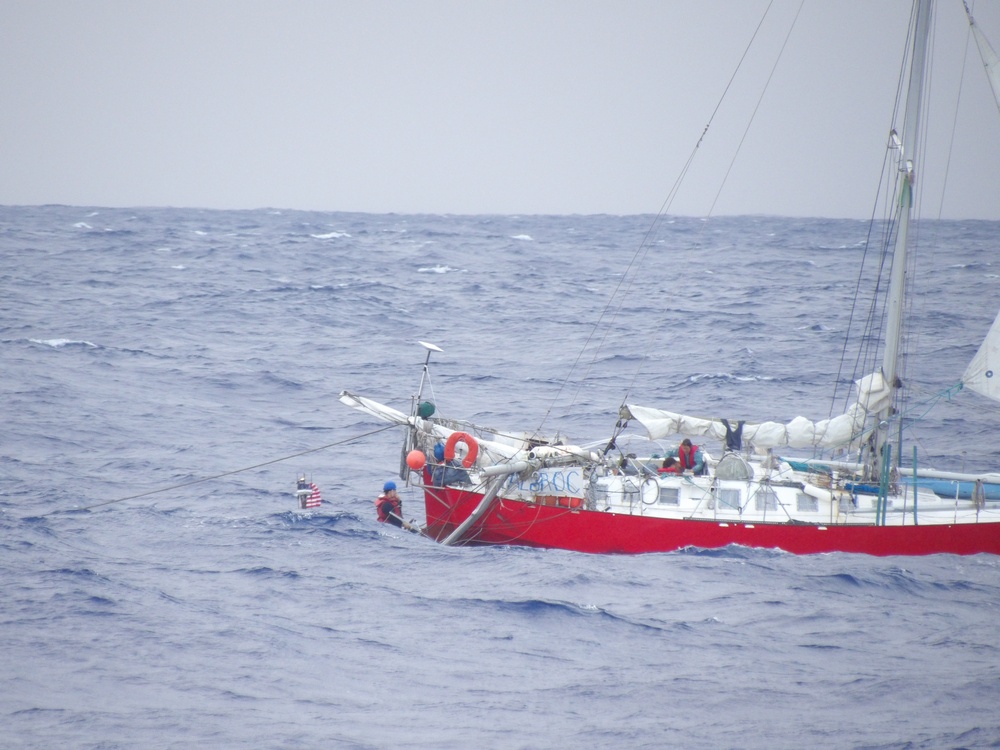 Coast Guard, Navy rescue woman, child, pets from sailboat beset by weather 925 miles off Honolulu