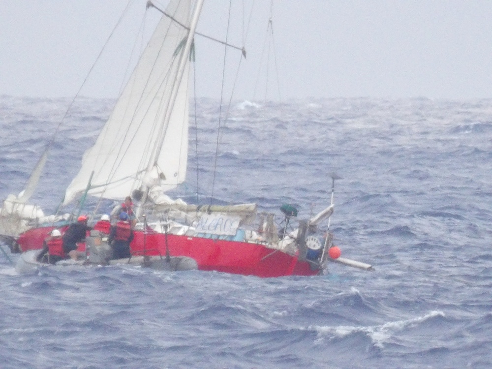 Coast Guard, Navy rescue woman, child, pets from sailboat beset by weather 925 miles off Honolulu