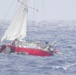 Coast Guard, Navy rescue woman, child, pets from sailboat beset by weather 925 miles off Honolulu