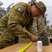 Team of joint multinational service members conducts simulated live explosive disposal training during Operation Render Safe 24