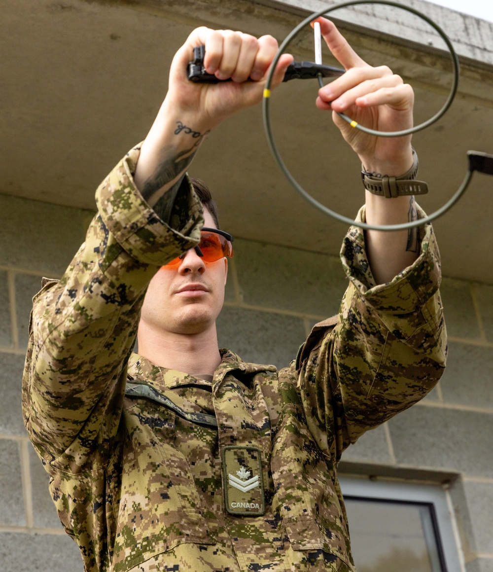 Team of joint multinational service members conducts simulated live explosive disposal training during Operation Render Safe 24