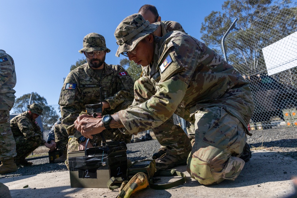 Team of joint multinational service members conducts simulated live explosive disposal training during Operation Render Safe 24