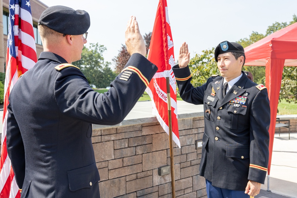 LTC Donald K. Lew recites the oath of office.