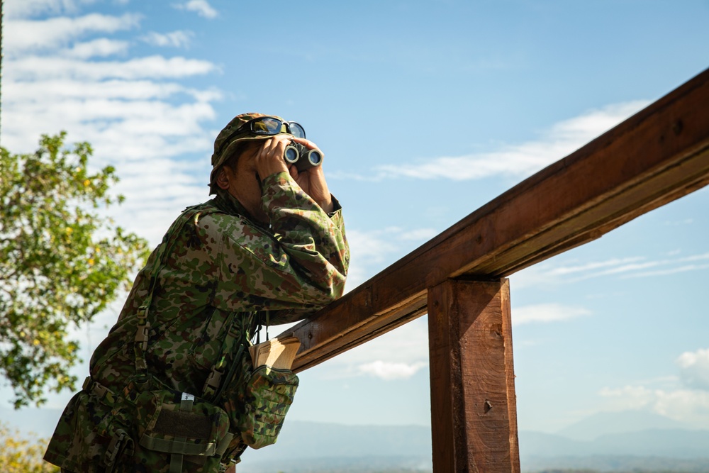 A member of the Japan Self Defense Force surveys the landscape from the balcony while training with U.S. Air Force Tactical Air Control Party during Super Garuda Shield 2024