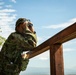 A member of the Japan Self Defense Force surveys the landscape from the balcony while training with U.S. Air Force Tactical Air Control Party during Super Garuda Shield 2024