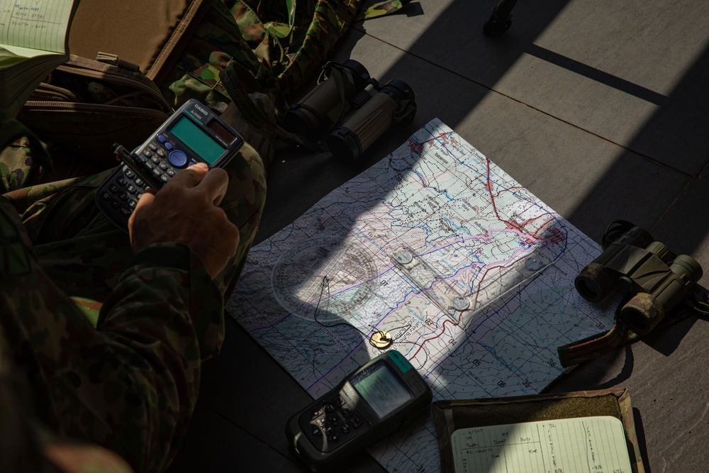 Members of the Japan Self Defense Force calculate and plot points for air support while training with U.S. Air Force Tactical Air Control Party during Super Garuda Shield 2024