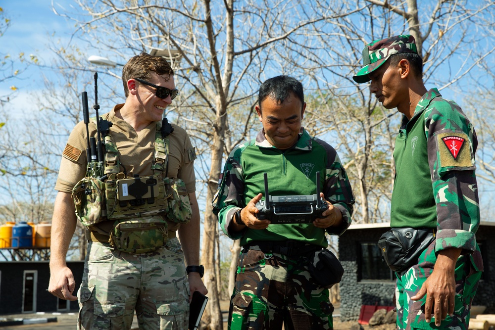 Members of the Indonesian National Armed Forces test fly a quadcopter drone with U.S. Air Force Tactical Air Control Party during Super Garuda Shield
