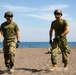 Members of the Japanese armed forces walk to prepare their boats during Super Garuda Shield 2024