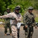 Nanda Wijaya (left), a civilian interpreter, translates instructions to members of the Indonesian National Armed Forces Korps Marinir during Super Garuda Shield 2024