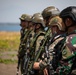 U.S. Marines, members of the Indonesian National Armed Forces Korps Marinir and Japanese armed forces stand together for an amphibious landing training exercise during Super Garuda Shield 2024