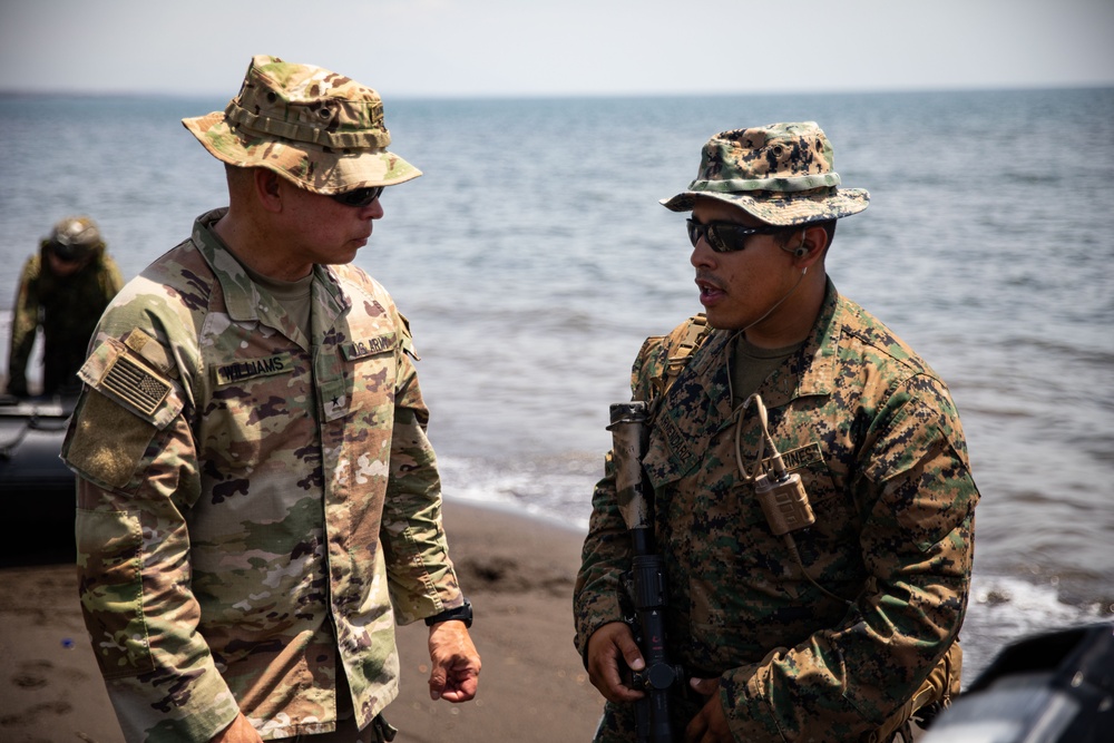 U.S. Marines Capt. Nathaniel Armendariz briefs U.S. Army Brig. Gen. Kevin J. Williams on the amphibious landing training during Super Garuda Shield 2024