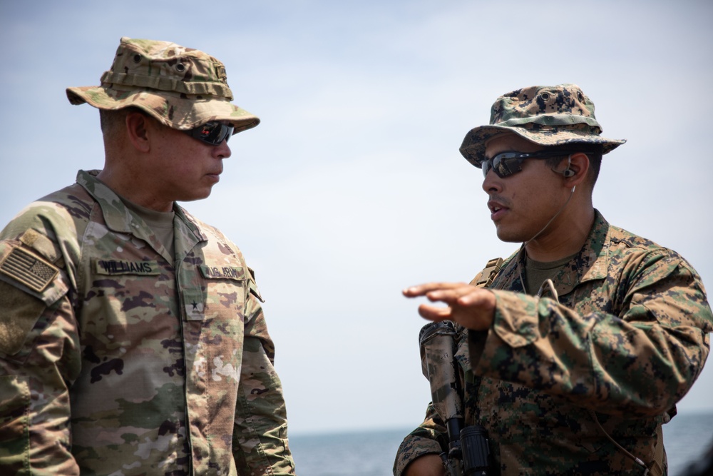 U.S. Marines Capt. Nathaniel Armendariz briefs U.S. Army Brig. Gen. Kevin J. Williams on the amphibious landing training during Super Garuda Shield 2024