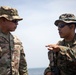 U.S. Marines Capt. Nathaniel Armendariz briefs U.S. Army Brig. Gen. Kevin J. Williams on the amphibious landing training during Super Garuda Shield 2024