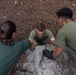 Swedish service members lead U.S. Marines through obstacle course