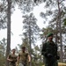 Swedish service members lead U.S. Marines through obstacle course