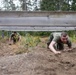 Swedish service members lead U.S. Marines through obstacle course