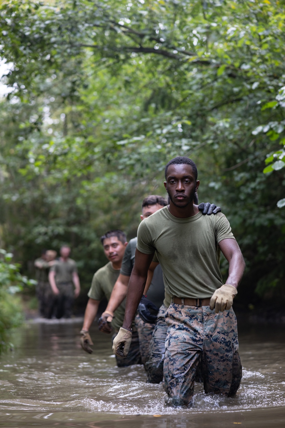 Swedish service members lead U.S. Marines through obstacle course