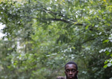 Swedish service members lead U.S. Marines through obstacle course