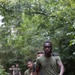 Swedish service members lead U.S. Marines through obstacle course