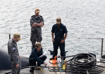 Sailors Aboard USS Hawaii Perform Bridal Blow Maintenance during STMP at HMAS Stirling