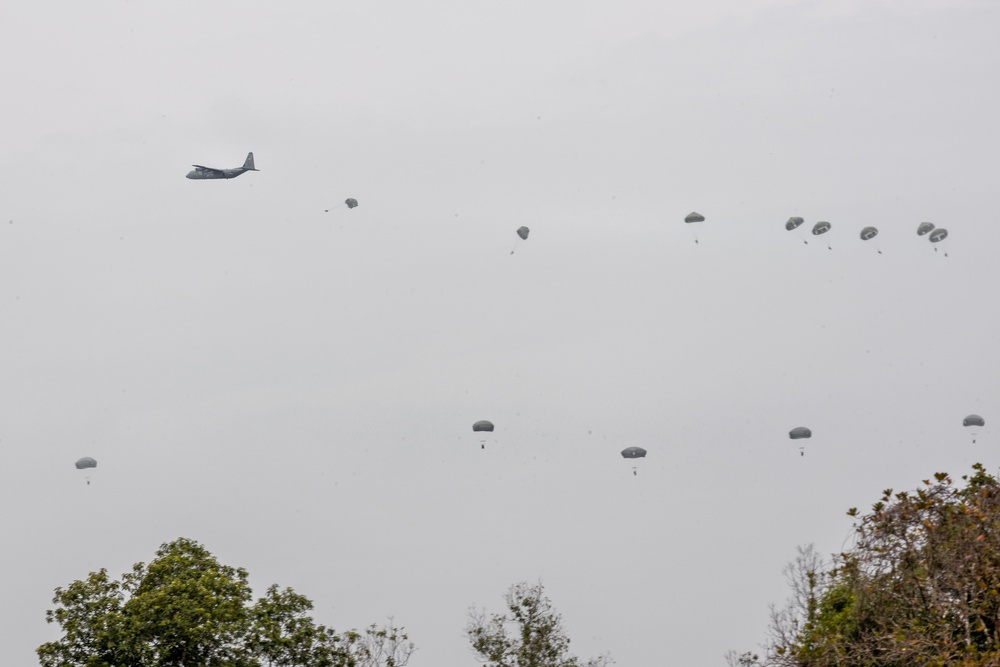 Multinational service members parachute from C-130J Super Hercules during Super Garuda Shield 2024