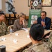 Representatives of the Consumer Financial Protection Bureau visit with JBER leadership, servicemembers, and military spouses