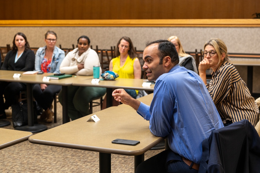 Representatives of the Consumer Financial Protection Bureau visit with JBER leadership, servicemembers, and military spouses