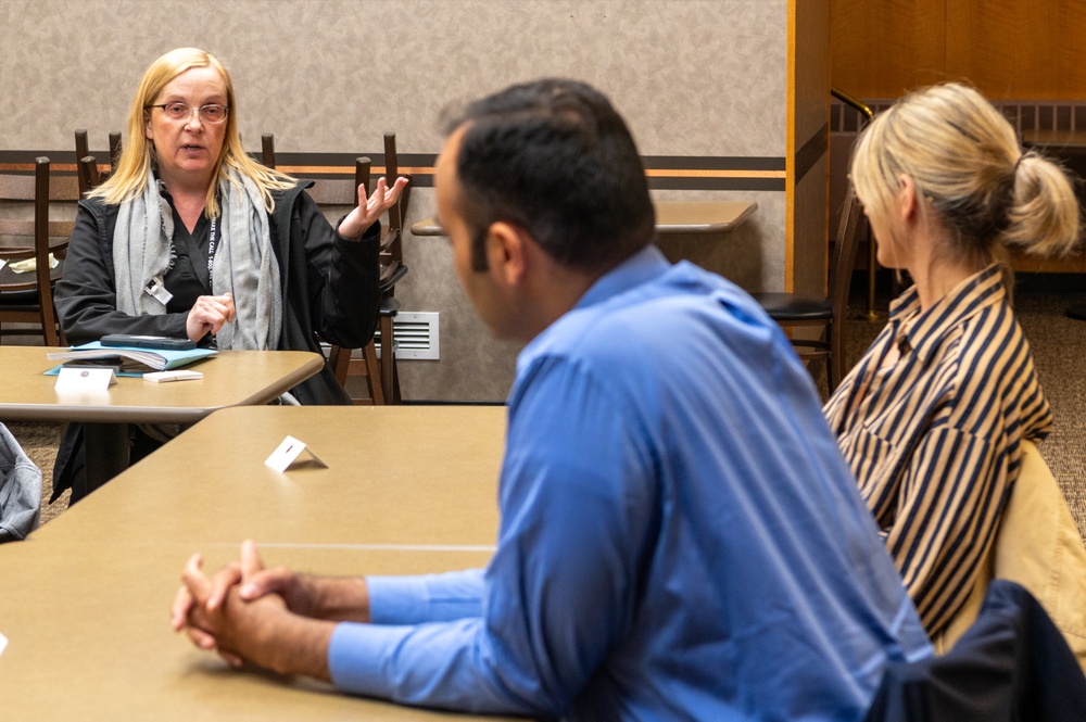 Representatives of the Consumer Financial Protection Bureau visit with JBER leadership, servicemembers, and military spouses