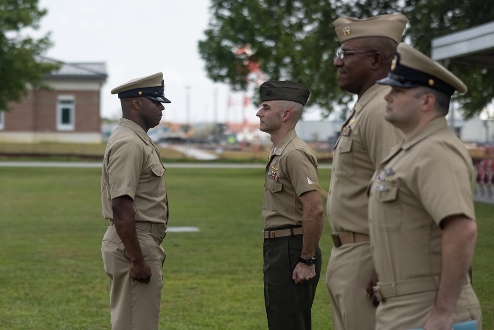 U.S. Navy Chief Religious Program Specialist Kenneth Armstead receives the Fleet Marine Force Warfare Insignia