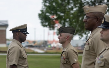 U.S. Navy Chief Religious Program Specialist Kenneth Armstead receives the Fleet Marine Force Warfare Insignia