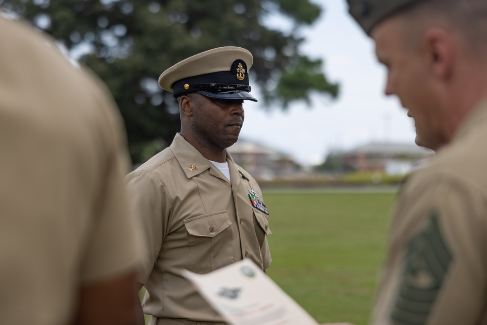 U.S. Navy Chief Religious Program Specialist Kenneth Armstead receives the Fleet Marine Force Warfare Insignia