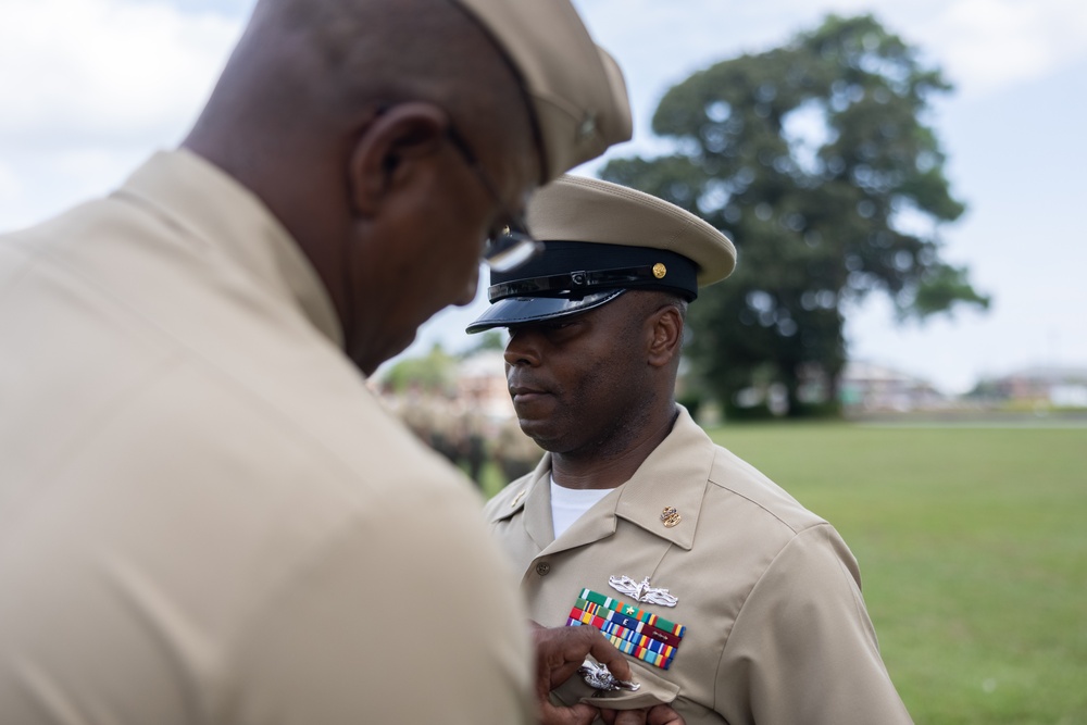 U.S. Navy Chief Religious Program Specialist Kenneth Armstead receives the Fleet Marine Force Warfare Insignia