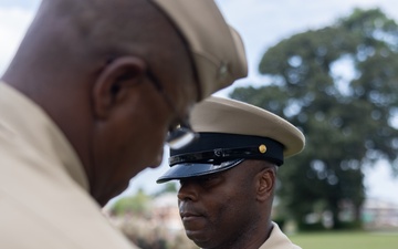 U.S. Navy Chief Religious Program Specialist Kenneth Armstead receives the Fleet Marine Force Warfare Insignia