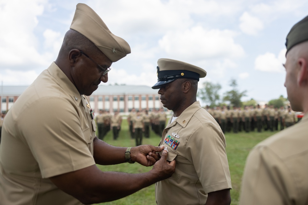 U.S. Navy Chief Religious Program Specialist Kenneth Armstead receives the Fleet Marine Force Warfare Insignia