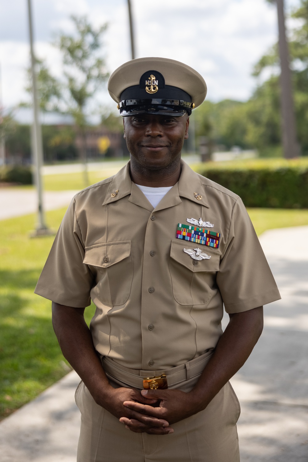 U.S. Navy Chief Religious Program Specialist Kenneth Armstead receives the Fleet Marine Force Warfare Insignia