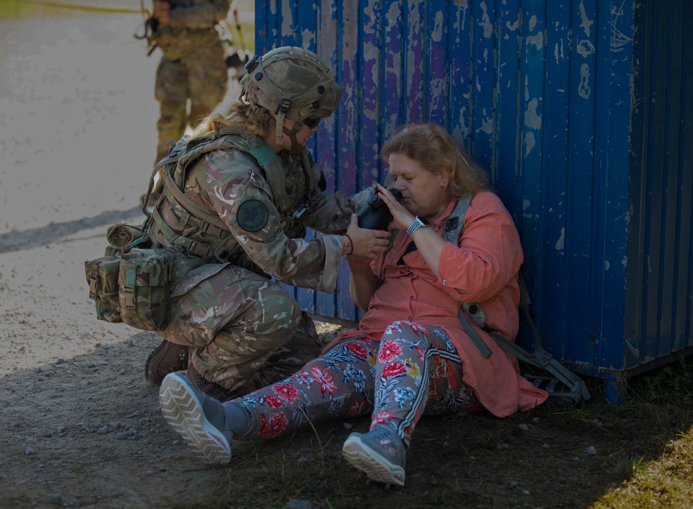 Soldiers conduct refugee response