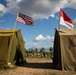 The flags of the United States of America and the Republic of Indonesia fly above Sekolah Dasar Negeri 2, during Super Garuda Shield 2024